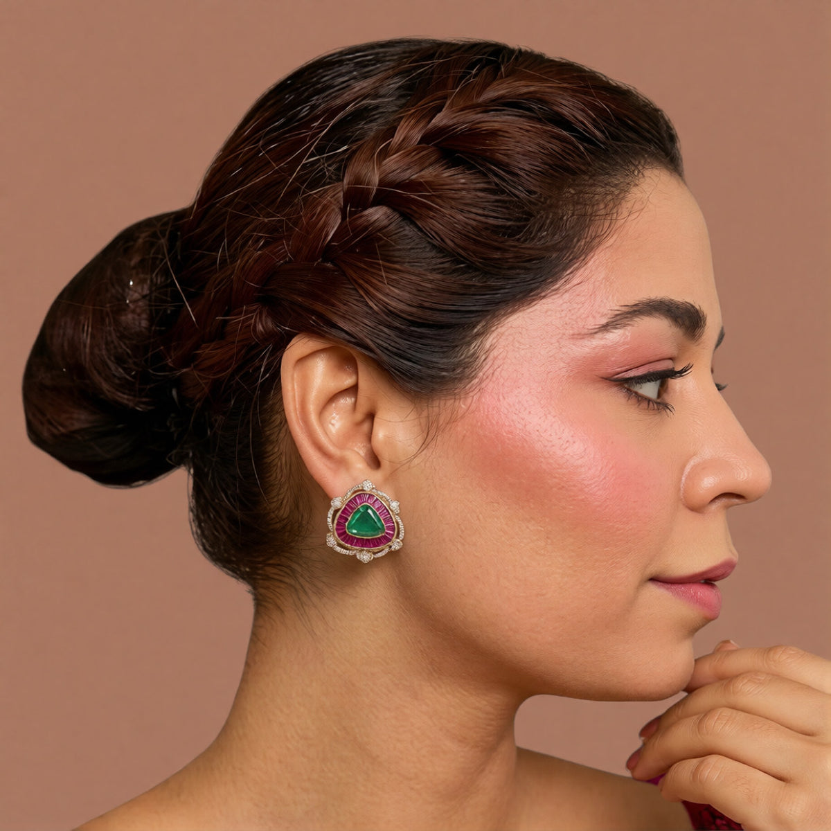Pair of gold halo stud earrings with emerald-green triangle centre stones, ruby-pink baguette borders and zircon