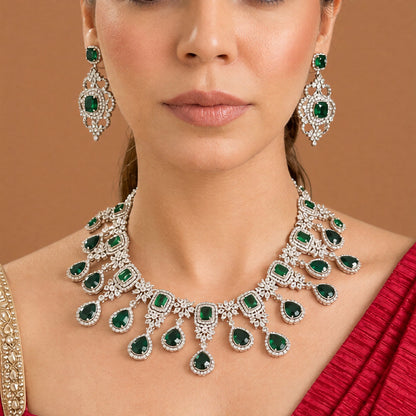 Silver finish American diamond choker necklace set with emerald green stones, pear drops, zircon flower motifs and matching scrollwork drop earrings – Auraa Trends