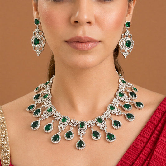 Silver finish American diamond choker necklace set with emerald green stones, pear drops, zircon flower motifs and matching scrollwork drop earrings – Auraa Trends