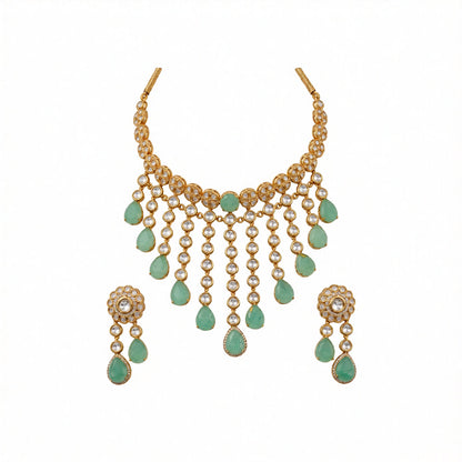 Gold kundan polki choker necklace set with mint green pear drops and matching floral earrings by Auraa Trends