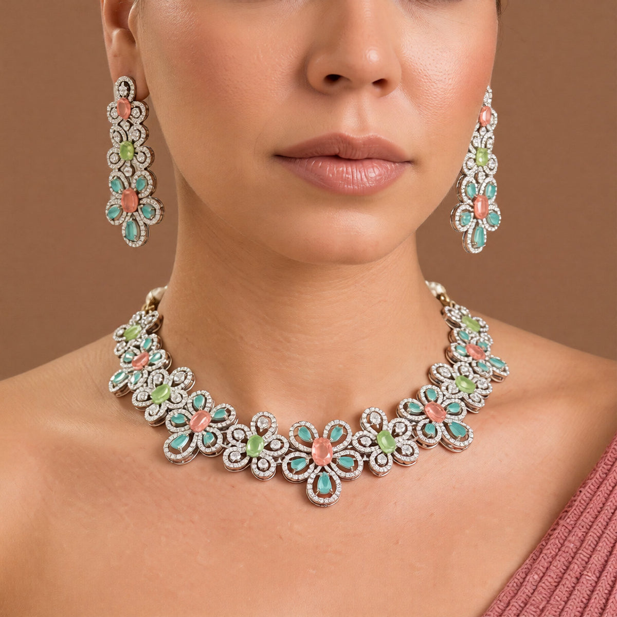 Silver-tone American diamond floral choker necklace set with coral-pink, light-green and mint stones and matching long drop earrings