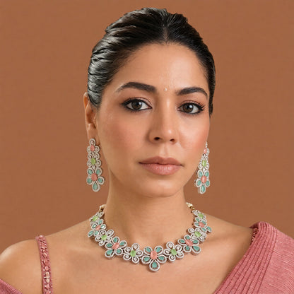 Silver-tone American diamond floral choker necklace set with coral-pink, light-green and mint stones and matching long drop earrings