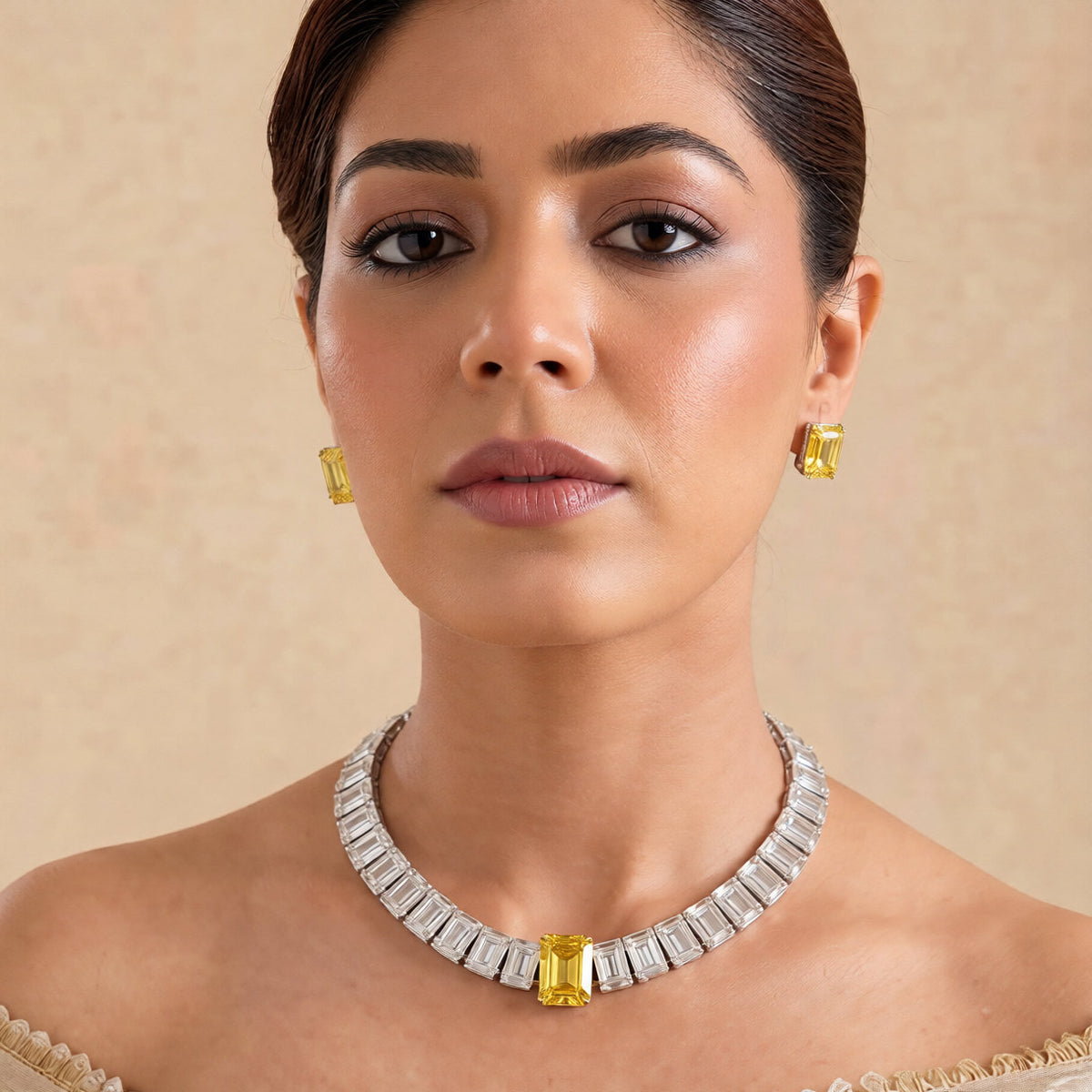Rhodium American diamond tennis necklace with emerald-cut clear stones, yellow centre stone and matching yellow stud earrings 