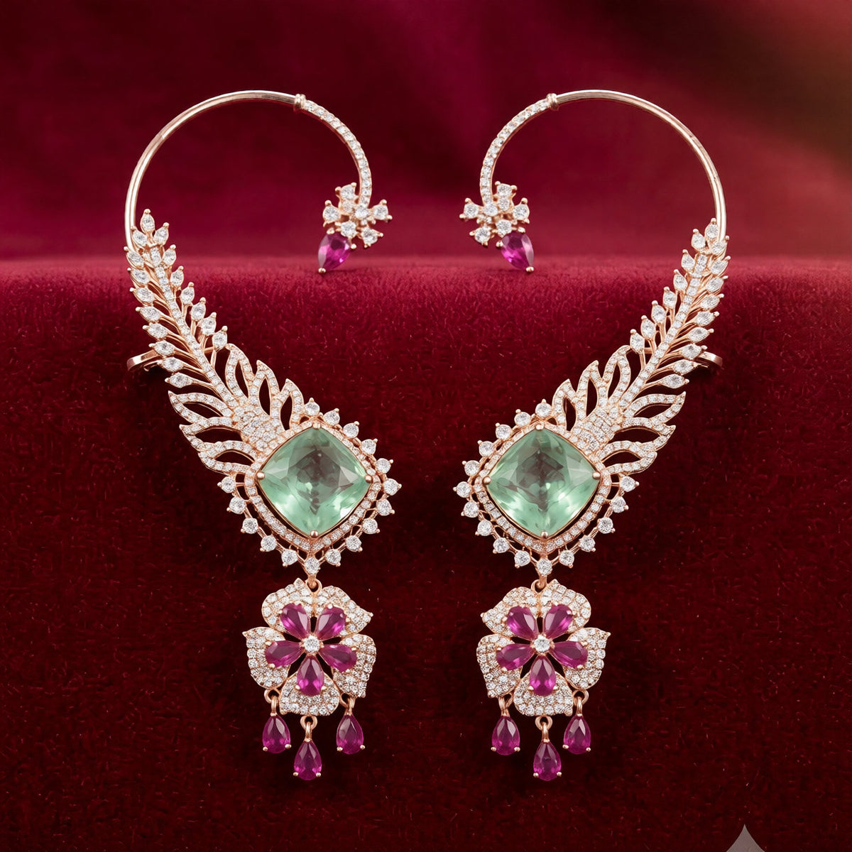 Rose gold American diamond ear cuff earrings with feather design, mint green cushion-cut stone and ruby pink flower drop