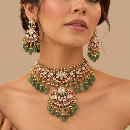Antique gold jadau kundan polki bridal choker necklace set with ruby-pink and green stones, crescent pendant, mint green bead drops and matching chandbali earrings
