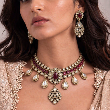 Gold-finish ruby red kundan polki bridal choker necklace set with teardrop polki drops, lattice pendant and matching earrings
