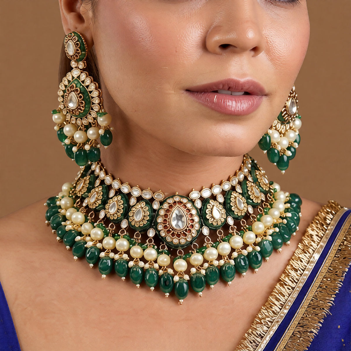 Gold-finish green meenakari kundan polki bridal choker necklace set with pearl and emerald bead drops and matching chandelier earrings