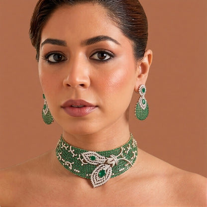 Emerald green American diamond wide choker necklace set with white zircon leaf motif and matching teardrop pavé earrings