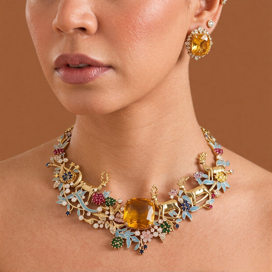 Gold plated stag design necklace with blue enamel leaves, multicolour stone flowers and yellow centre stone
