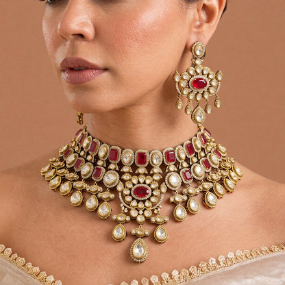 Antique gold ruby red Victorian bridal choker necklace set with kundan-style stones, ruby oval centre medallion, pear drops and matching chandelier earrings