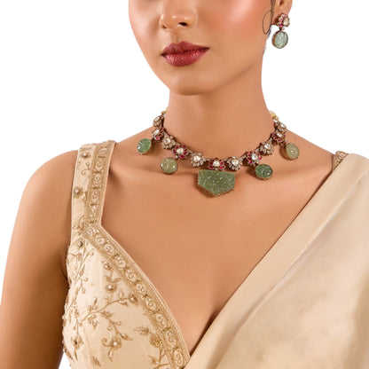 Lotus Motif Carved Green Stone Necklace Set with Earrings | Ethnic & Festive Jewelry - Auraa Trends - Necklace -  - Auraa Trends - “Necklace set with lotus motif and carved green stones with earrings” “Traditional gold - tone necklace with pink lotus and kundan stones” “Ethnic lotus design choker set with matching earrings”