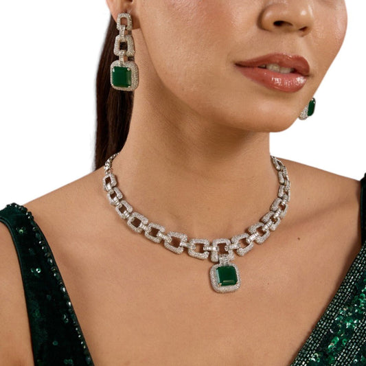 Luxury Emerald Green &amp; Diamond Link Chain Necklace and Earrings Set - Auraa Trends - necklace -  - Auraa Trends - Lady who is sporting a luxurious jewelry set that consists of an emerald green pendant