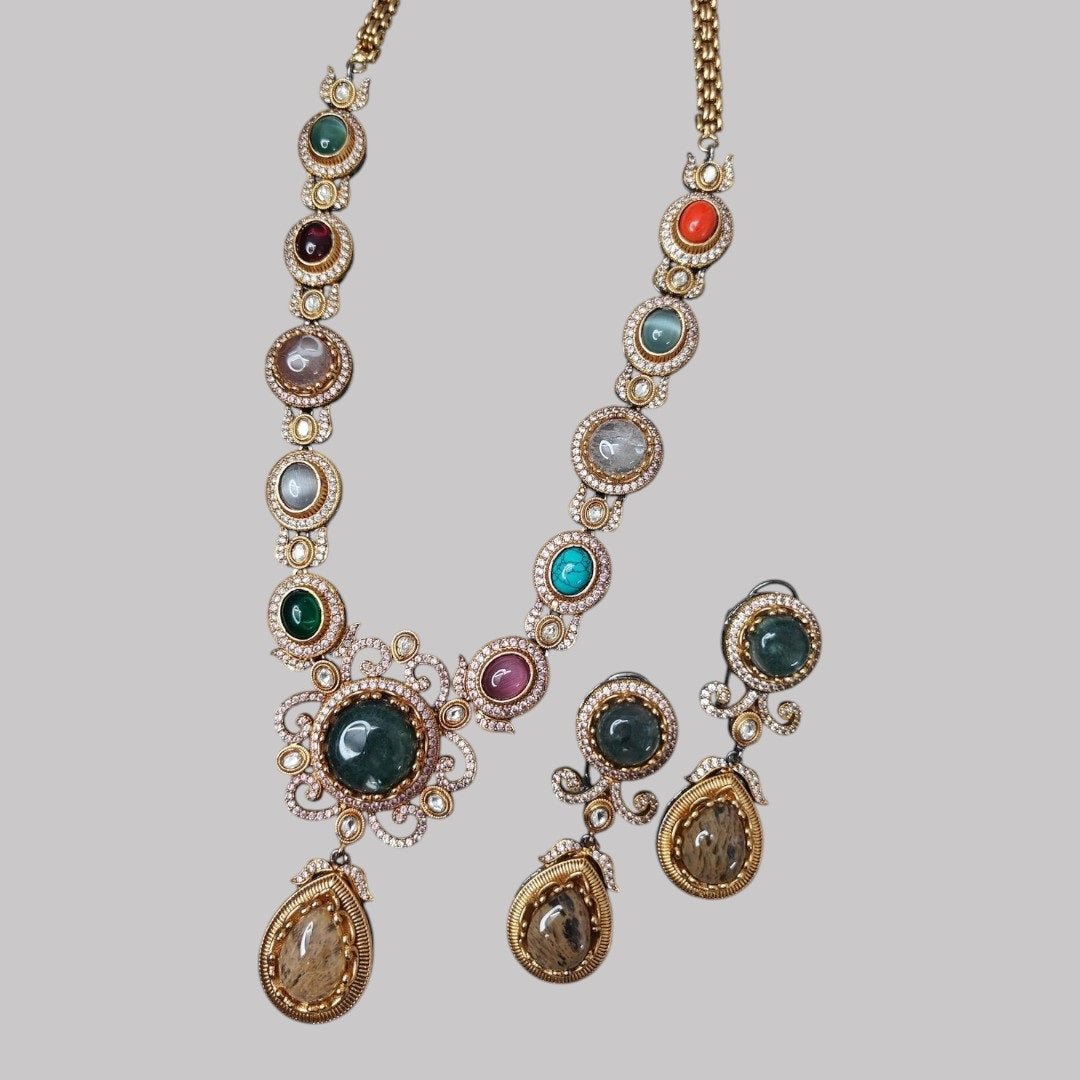 Multicolor Gemstone Necklace Set with Earrings - Auraa Trends - Necklace Set -  - Auraa Trends - "Antique multicolor gemstone necklace set with earrings, teardrop pendant design, polished cabochon stones, and traditional ethnic finish