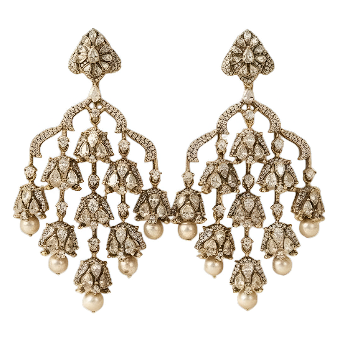 "Antique oxidized Polki-style chandelier earrings with multi-tier floral clusters and pearl drops, front-facing pair on white background"