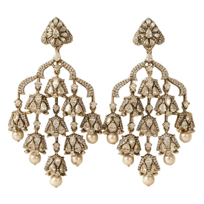 "Antique oxidized Polki-style chandelier earrings with multi-tier floral clusters and pearl drops, front-facing pair on white background"