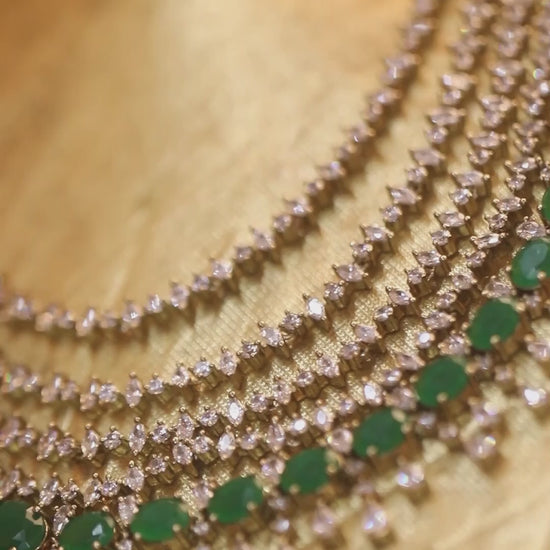 Silver-tone multi-layer emerald green necklace set with chandelier earrings, statement bridal jewelry with oval green stones and crystal detailing