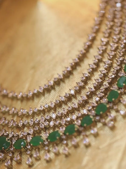 Silver-tone multi-layer emerald green necklace set with chandelier earrings, statement bridal jewelry with oval green stones and crystal detailing