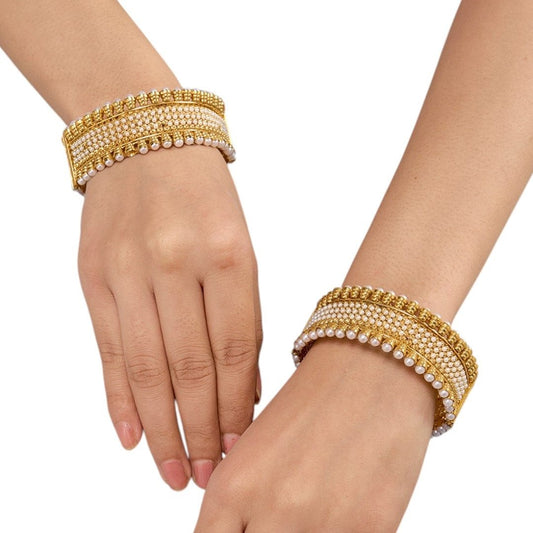 Traditional Gold - Plated Pearl Studded Broad Kada Bangles for Women - Auraa Trends - Bangles -  - Auraa Trends - "Pair of traditional gold - plated broad kada bangles embellished with rows of faux pearls for festive wear"