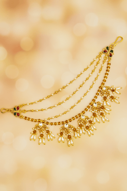 Traditional Kundan & Pearl Multi - Layer Kaan Chain - Auraa Trends - Kaan chain -  - Auraa Trends - Elegant multi - layered Kundan and pearl golden Kaan Chain (Ear Chain) with floral motifs and dangling pearl drops, displayed with decorative flowers and seashell.