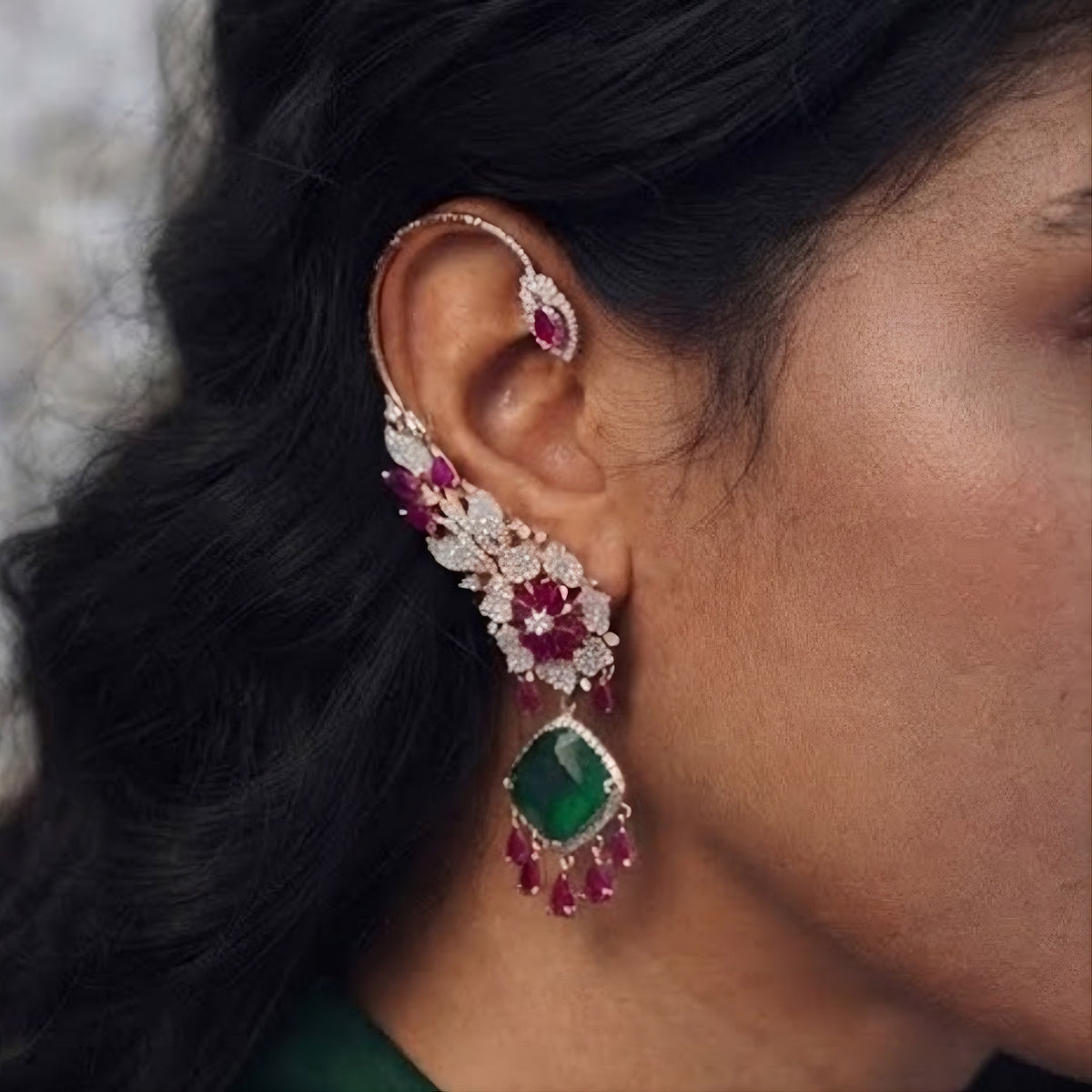Rose gold American diamond ear cuff earrings with ruby pink pear stones, pavé floral design and emerald green cushion-cut drop