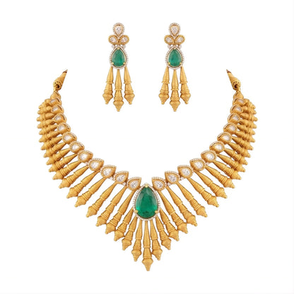 Antique matte gold necklace set with gold cone drops, polki kundan stones, emerald green pear centre stone and matching drop earrings